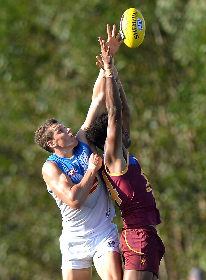 AFL 2016 NAB Challenge - Brisbane Lions v Gold Coast Daniel Currie and Archie Smith battle in the ruck on Sunday - ${keywords}
